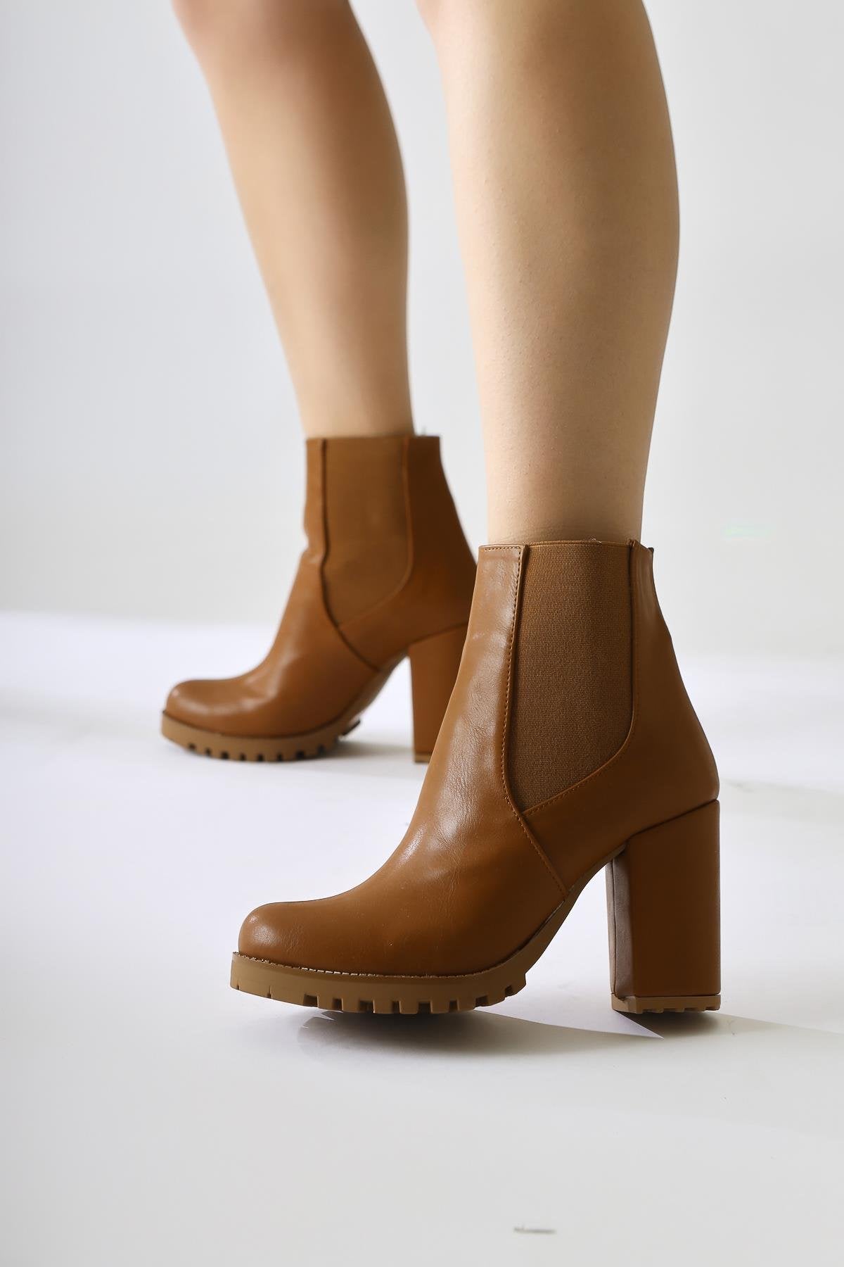 Dorsaf Tan Oval Toe Elastic Heeled Boots