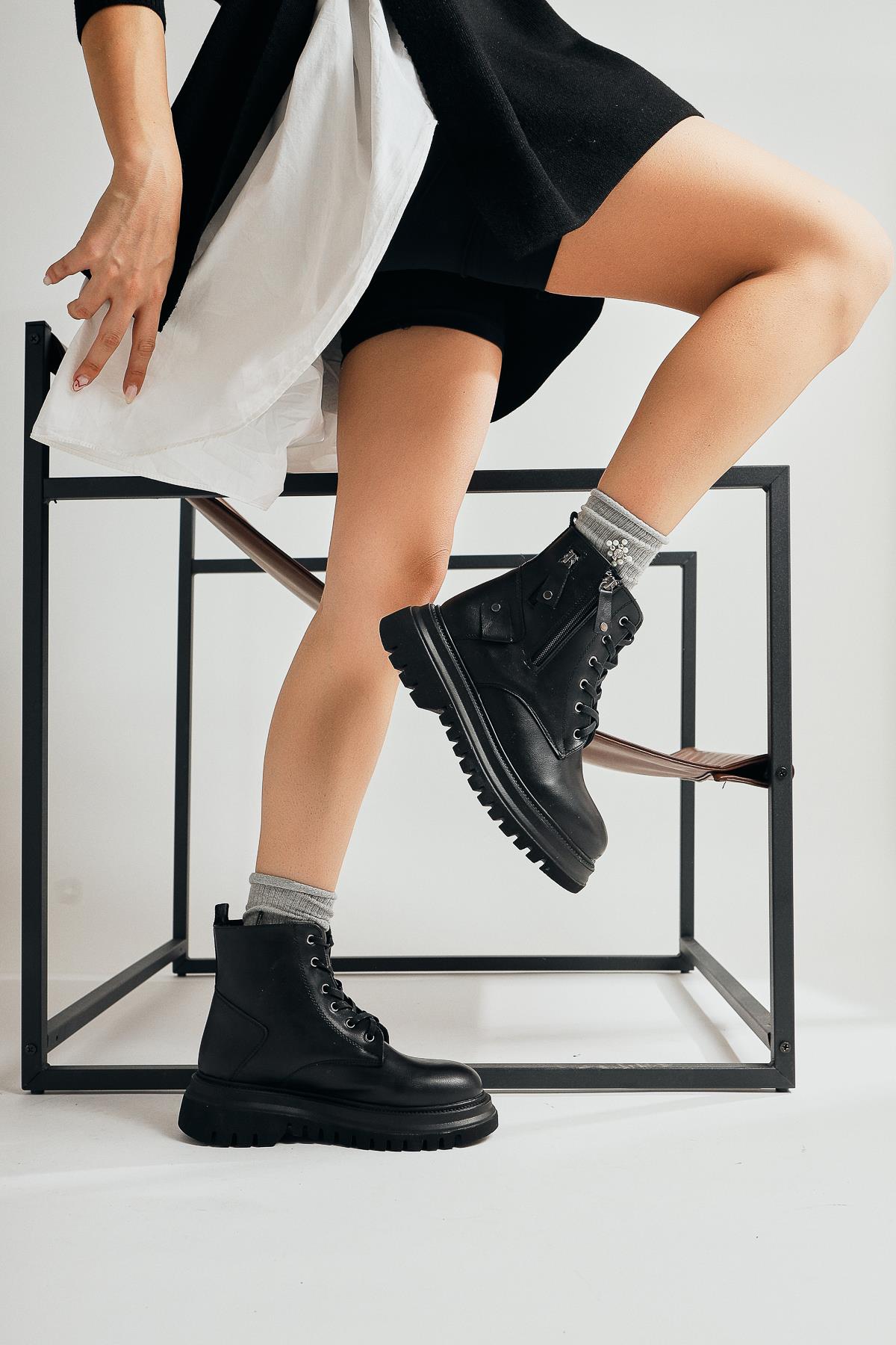 Esta Black Zippered Boots with Staple Detail