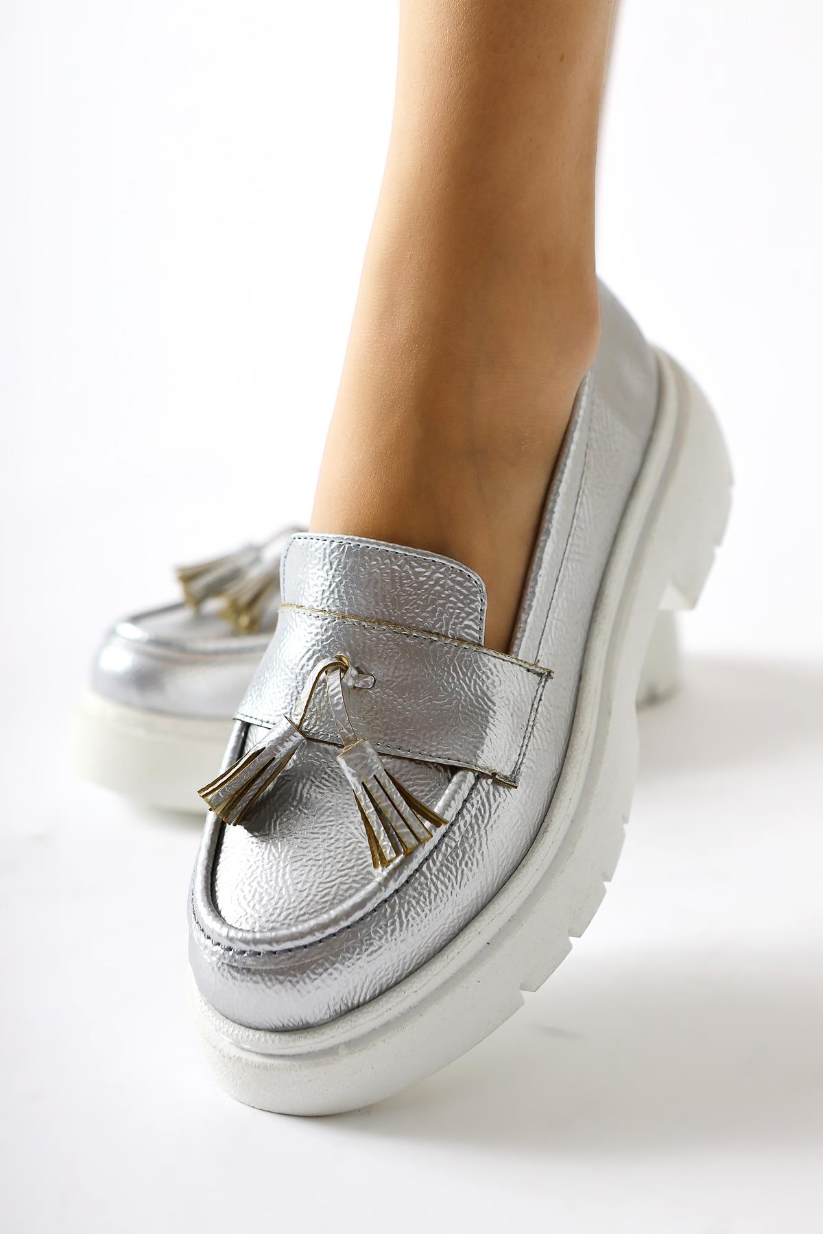 Linni Silver Crinkle Patent Leather Tasseled Loafers