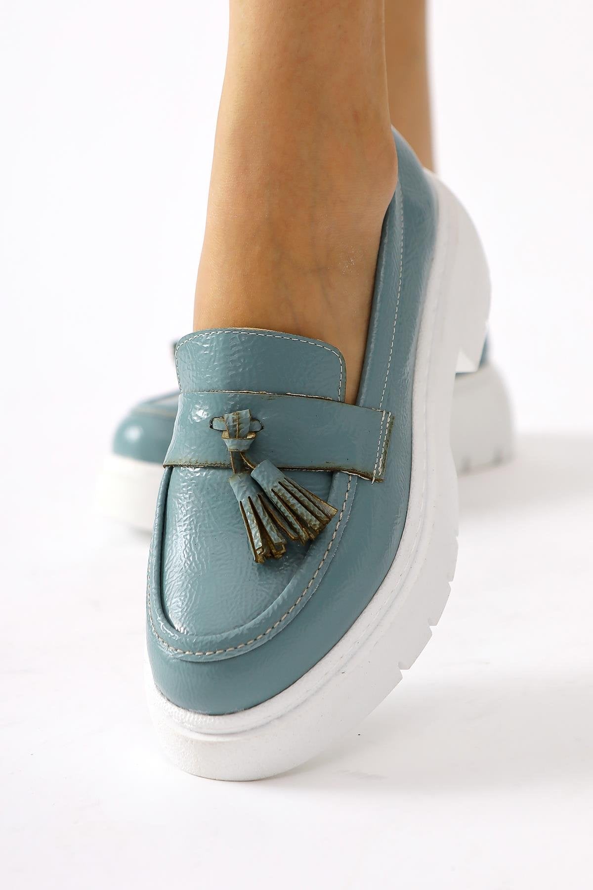 Linni Turquoise Crinkle Patent Leather Tasseled Loafers