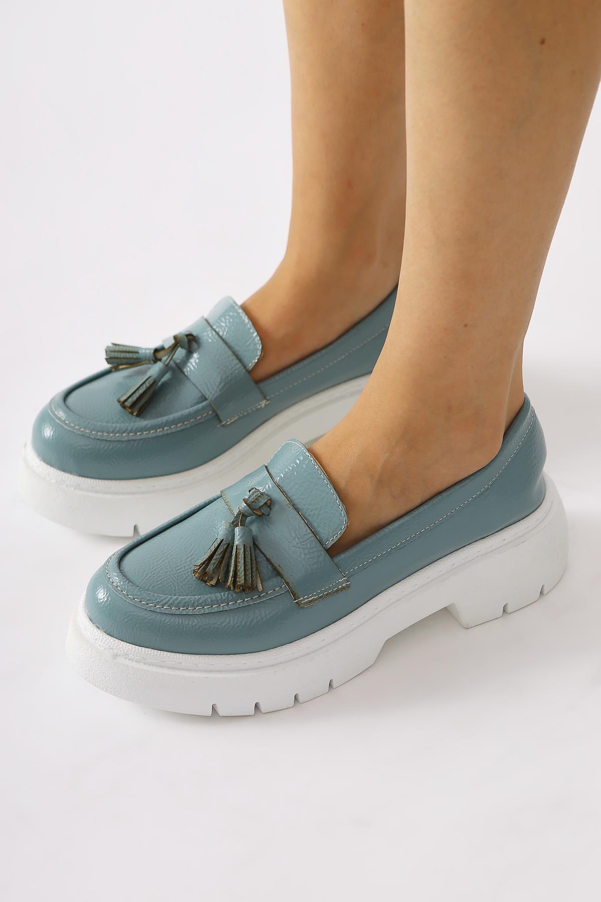 Linni Turquoise Crinkle Patent Leather Tasseled Loafers