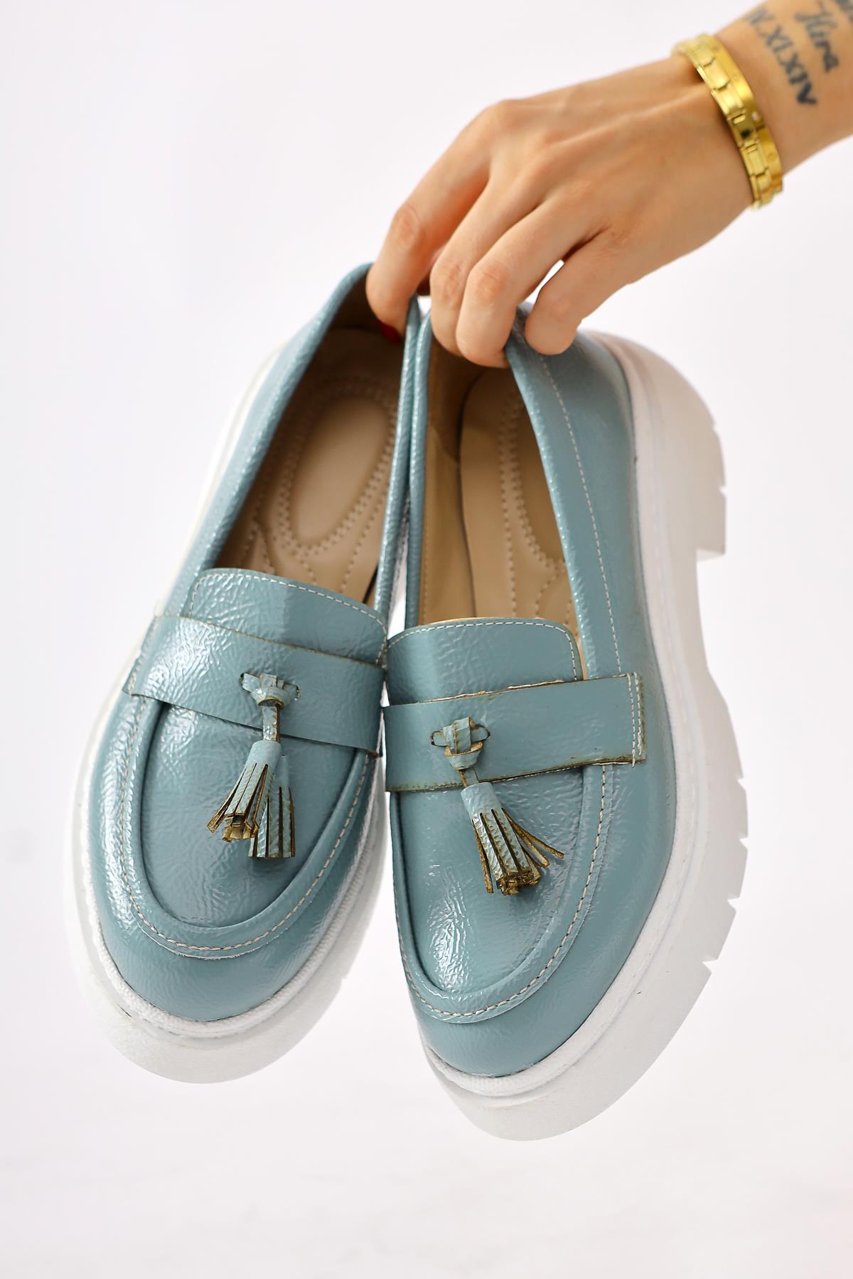 Linni Turquoise Crinkle Patent Leather Tasseled Loafers